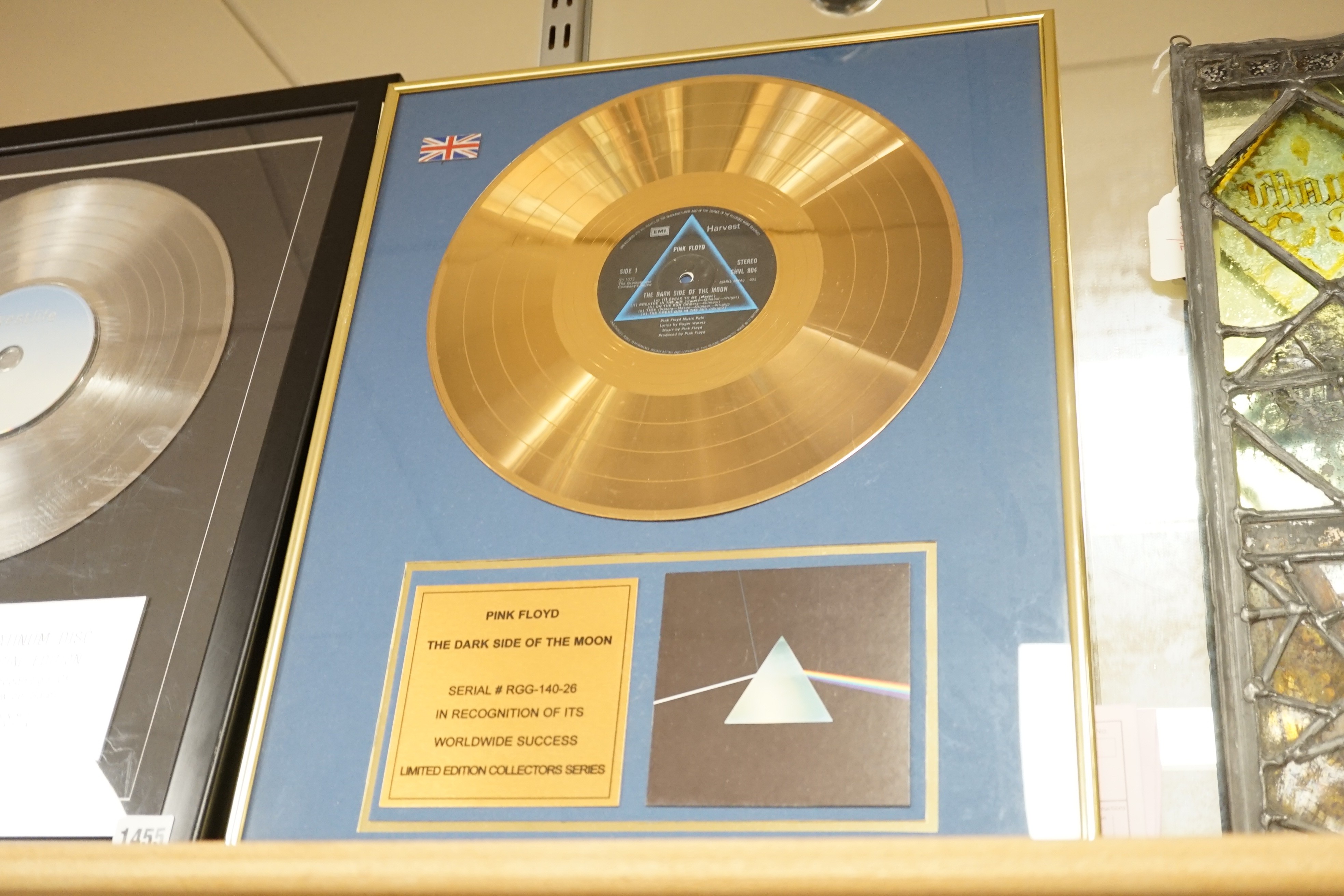 Three glazed framed award winning records: Pink Floyd, The Rolling Stones and Westlife